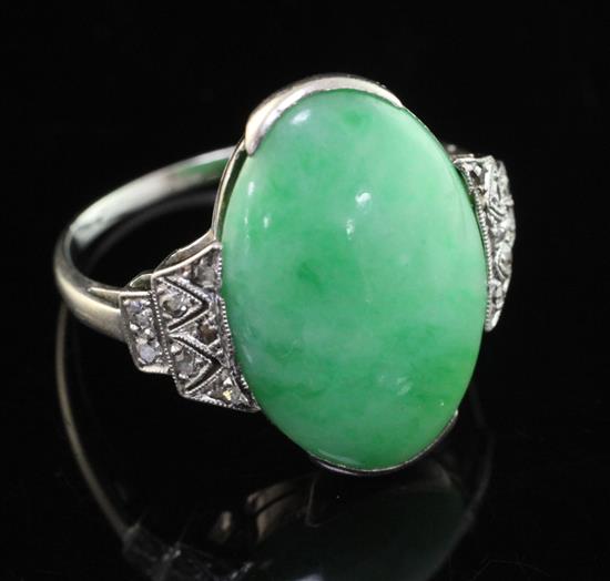 An 18ct white gold, cabochon jadeite and diamond set ring, size O.
